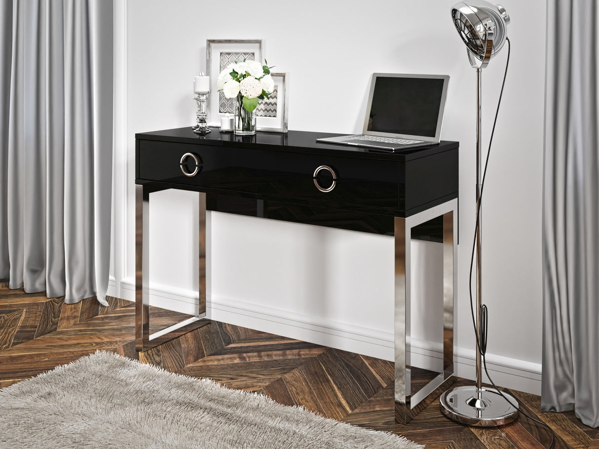 Milla Desk In Black GlossFeatures: Dimensions: W110cm x H80cm x D40cm Colour: Black Gloss & Chrome One Drawer, Chrome Legs and Handles Weight: 29kg Assembly Required Made from 16mm high-quality laminated board Specifications: Dimensions: H:80.0 x W:110.0