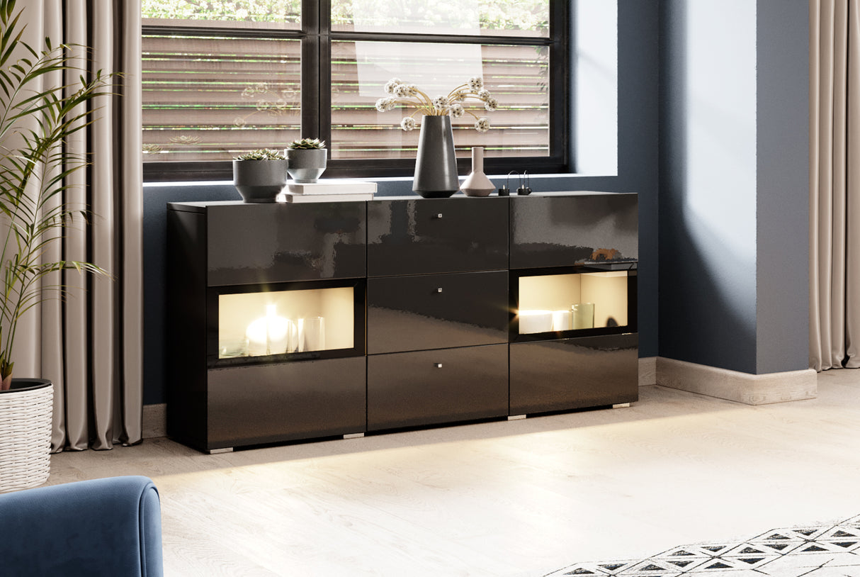 SIDEBOARD ATHENS 132CM BLACK GLOSS / BLACKThe Athens 26 sideboard cabinet has a functional, modern and brilliantly crafted design, blending in seamlessly with your contemporary home. Three drawers and two partially-glazed hinged doors allow you to store a