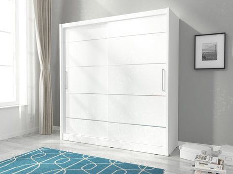 SLIDING DOOR WARDROBE MAJA ALU 180CM WHITESliding wardrobes with mirrors - a clever way to optically enlarge the room Maximize your space with the MAJA ALU 180CM WHITE sliding door wardrobe. Color: Body: WHITE Front: white + silver strips The wardrobe's s