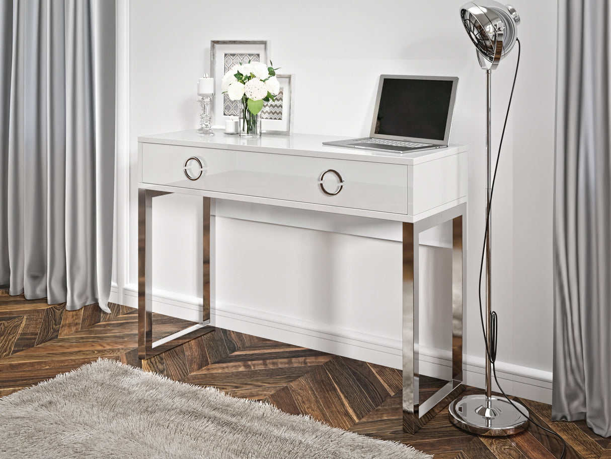 Milla Desk In White GlossFeatures: Dimensions: W110cm x H80cm x D40cm Colour: White Gloss & Chrome One Drawer, Chrome Legs and Handles Weight: 29kg Assembly Required Made from 16mm high-quality laminated board Specifications: Dimensions: H:80.0 x W:110.0