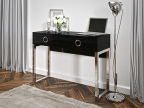 Milla Desk In Black GlossFeatures: Dimensions: W110cm x H80cm x D40cm Colour: Black Gloss & Chrome One Drawer, Chrome Legs and Handles Weight: 29kg Assembly Required Made from 16mm high-quality laminated board Specifications: Dimensions: H:80.0 x W:110.0