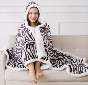 Super Soft Warm Sherpa Fleece Wearable Hoodie Blankets ZEBRA Designs -130 x 180 cmMeet the Super Plush Teddy Fleece Hoodie Blanket, the perfect companion for your cozy nights and cold winter days. Made with love and incredible attention to detail, this bl