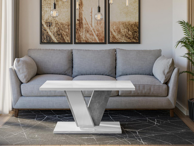 COFFEE TABLE VINEY WHITE GLOSS / STONE GREYCoffee Table Viney White Gloss / Stone Grey The COFFEE TABLE VINEY brings a distinct and contemporary look to any space. Its unconventional design adds a fresh and airy feel to your home decor. Perfect for the di