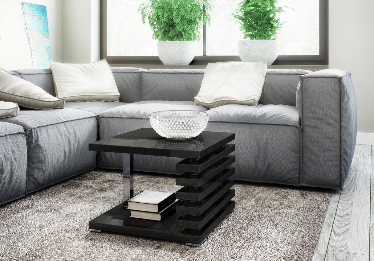 COFFEE TABLE KYOTO BLACK GLOSSIntroducing COFFEE TABLE KYOTO, an ideal addition to any corner or regular sofa. Its sleek and contemporary rung-shaped structure, adorned with metallic accents, makes it a standout piece. Constructed from a 32mm thick board,