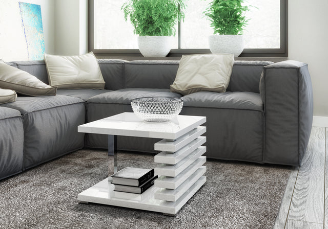 COFFEE TABLE KYOTO WHITE GLOSSIntroducing COFFEE TABLE KYOTO, an ideal addition to any corner or regular sofa. Its sleek and contemporary rung-shaped structure, adorned with metallic accents, makes it a standout piece. Constructed from a 32mm thick board,