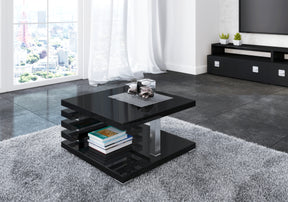 COFFEE TABLE KYOTO BLACK GLOSSIntroducing COFFEE TABLE KYOTO, an ideal addition to any corner or regular sofa. Its sleek and contemporary rung-shaped structure, adorned with metallic accents, makes it a standout piece. Constructed from a 32mm thick board,
