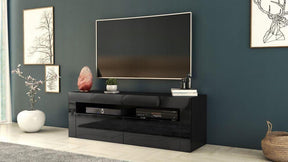 TV STAND DACO 2 BLACK GLOSS FRONTS 140CMDepth: 40 cmWidth: 140 cmHeight: 45 cmMinimalist designThe cabinet has 2 functional and roomy storage compartments.The furniture has high gloss lacquered fronts and the body of the furniture is matt.A modern RTV tab
